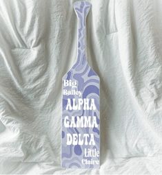 a bottle shaped sign that says, big bailey alera gammina delta little china