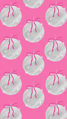 pink and white fabric with small round objects on the bottom, in front of a bright pink background