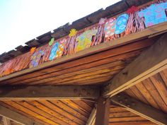 a wooden structure with colorful decorations on it