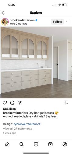 an instagramted photo of a kitchen with white cabinets