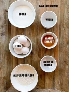 four bowls with different ingredients in them on top of a wooden table next to each other