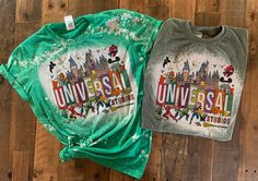 two t - shirts with the words universal and mickey mouse on them