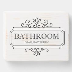 a bathroom sign with the words bathroom please seat yourself