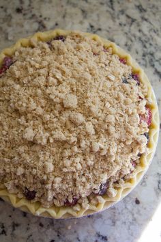 a pie sitting on top of a marble counter