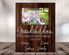 a wooden frame with an image of two children and the words granddaughter, complete life's circle of love