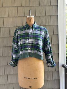 This upcycled flannel top combines elements from two vintage shirts, merging patterns and textures into a unique, sustainable design. Plaid Cotton Tops For Daywear, Vintage Relaxed Fit Flannel Top, Vintage Flannel Relaxed Fit Top, Vintage Flannel Top With Relaxed Fit, Daywear Cotton Patchwork Tops, Cotton Patchwork Tops, Cotton Patchwork Tops For Daywear, Plaid Yarn-dyed Cotton Tops, Vintage Plaid Patchwork Tops