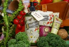 a bottle of hand soap surrounded by vegetables