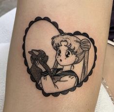 a girl with a bird tattoo on her thigh