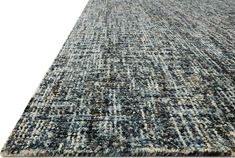 an area rug with blue and gray colors on it, including the middle section of the rug