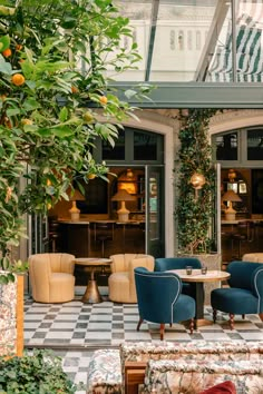 an outdoor seating area with chairs and tables