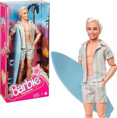 a barbie doll is standing next to a surfboard