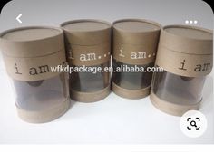 four cardboard cups with i am written on them