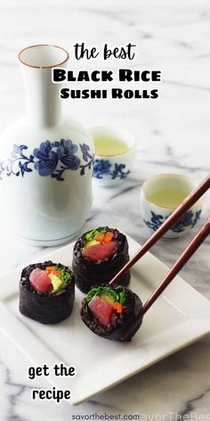 sushi rolls on a plate with chopsticks in front of it and the words, the best black rice sushi rolls