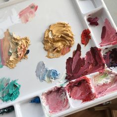 an artist's palette with several different colors of paint