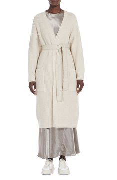 Feel like you're snuggled up in a blanket wherever you go in this duster cardigan knit from a wool-rich blend and secured with a tie belt. Open front V-neck Ribbed cuffs and hem Front patch pockets Removable tie belt 66% wool, 32% polyamide, 2% elastane Hand wash, dry flat Imported Cardigan Knit, Duster Cardigan, Beige Cardigan, Ribbed Cardigan, Wrap Cardigan, Cotton Cardigan, Outerwear Coats, Long Sleeve Cardigan, Long Cardigan