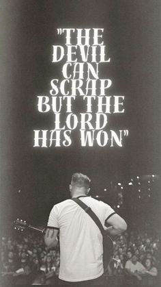 the devil can scrap but the lord has won poster with an image of a man holding a guitar