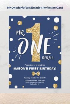 a blue and gold first birthday party card with the number one on it's front