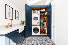 a washer and dryer are in the closet next to each other on the counter