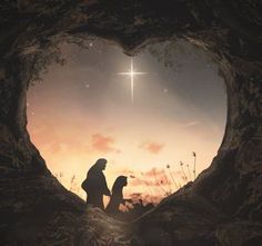 a man and woman sitting in the middle of a heart shaped cave with a star above them