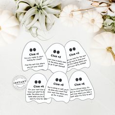 six ghost stickers with the words clue on them next to some pumpkins and succulents