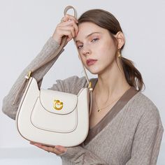 The semicircle design women shoulder bag. The simple and sophisticated design makes it look elegant, easy to wear with clothes, it is sophisticated and classic style. Clamshell sliding metal lock, unique golden lock shape and solid color PU leather bring the layered effect of color collision, so that the layers of the bag more distinct. Good for adding a hint of femininity to your looks, this bag will keep you looking your absolute best no matter the occasion.Weight: 490 gWidth (cm): 7 cmHeight Modern Gold Shoulder Bag With Turn-lock Closure, Gold Shoulder Bag With Turn-lock Closure For Office, Chic Gold Shoulder Bag With Turn-lock Closure, Gold Shoulder Bag With Turn-lock Closure, Elegant Beige Shoulder Bag With Metal Hardware, Retro Shoulder Bag, Buckle Bags, Boot Bag, Wallet Accessories