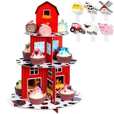 a red barn cake stand with cupcakes and farm animals on the top tier