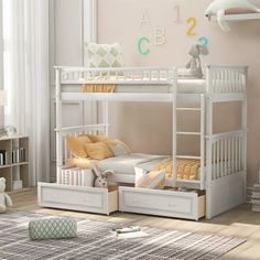 a white bunk bed with drawers underneath it