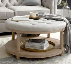 a round coffee table with a tray on it