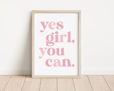 a pink print with the words yes girl, you can on it in front of a white wall