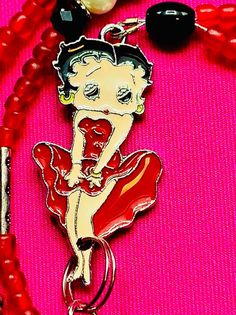 Vintage Betty Boop necklace , red and black beads Trendy Red Necklaces With Colorful Beads, Trendy Red Necklace With Colorful Beads, Trendy Red Round Bead Necklaces, Trendy Red Round Beads Necklace, Trendy Red Necklaces With Round Beads, Retro Red Necklace For Party, Red Beaded Chain Necklace For Valentine's Day, Valentine's Day Red Beaded Necklaces, Trendy Red Beaded Necklace