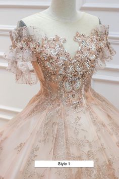 a dress on a mannequin with gold sequins and pink tulle