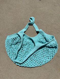 Introducing our Handmade Crochet Market Bag in a serene light blue hue, meticulously crafted with soft and durable cotton yarn. Embrace sustainable style with this eco-friendly accessory, perfect for your trips to the farmer's market, grocery store, or beach outings. Each stitch is carefully woven by hand, ensuring a sturdy and reliable construction that can carry your essentials with ease. The lightweight design makes it convenient to carry wherever you go, while the spacious interior provides ample room for your groceries, produce, or beach essentials. The refreshing light blue color adds a touch of tranquility to your ensemble, complementing any outfit with its understated elegance. Whether you're running errands or enjoying a day out in the sun, this crochet market bag is both practica Blue Crochet Beach Bag For Everyday Use, Eco-friendly Blue Crochet Bag For Everyday, Eco-friendly Cotton Crochet Bag For Travel, Eco-friendly Blue Crochet Bag, Eco-friendly Blue Crochet Bag For Vacation, Eco-friendly Cotton Crochet Bag For Market, Blue Crochet Eco-friendly Bags, Blue Eco-friendly Crochet Bag, Cotton Crochet Bag For Beach