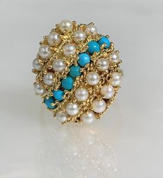 Harem Ring, Pearl Ring Vintage, Pearl Ring Yellow Gold, Turquoise Pearl Ring, Gemstone Ring Vintage, Turquoise Pearl Jewelry, Vintage Gold Jewelry A timeless vintage treasure. This genuine pearl and turquoise ring features 20 round shaped pearls accented by 7round shaped turquoise set in solid 14k gold. *Ring size: 7 3/4 *Ring weight: 9.59 Grams *Ring dimensions: 10X17mm Harem Rings, Pearl Ring Vintage, Vintage Pearl Ring, Pearl Ring Gold, Pearl Rings Vintage, Gemstone Rings Vintage, Ring Pearl, Gold Pearl Ring, Vintage Sapphire