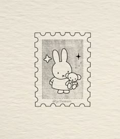 a stamp with an image of a bunny holding a teddy bear