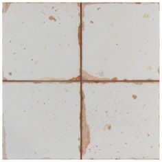 the tile is white with brown spots on it's edges and has been stained off