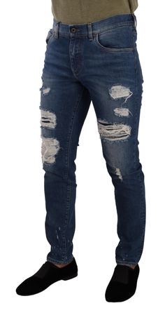 Embrace the epitome of Italian luxury with these exquisite Dolce & Gabbana distressed denim jeans. Defined by their sophisticated blue wash and slim fit silhouette, they offer a perfect blend of style and comfort. Crafted with impeccable attention to detail, these jeans feature a classic zipper and button closure, and are adorned with the iconic logo details. Whether for a casual day out or a stylish evening, these jeans are sure to elevate your wardrobe. Material: 98% Cotton 2% Elastane Color: Dolce And Gabbana Blue, Jean Crafts, Iconic Logo, Distressed Denim Jeans, Dolce E Gabbana, Dolce And Gabbana Man, Italian Luxury, Dolce & Gabbana, Jeans For Sale