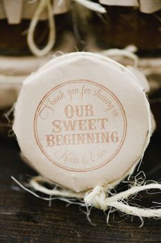 the label for our sweet beginning soap is on top of some twine and rope