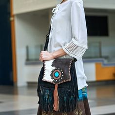 The Turquoise Charm Western Cowhide Fringe Purse is the perfect blend of style and function. This stylish bag is made with high-quality leather and features an eye-catching turquoise color that will surely turn heads. With its versatile design, this purse can be worn as a shoulder bag or a crossbody bag, making it perfect for any occasion. The cowhide fringe detail adds a touch of Western flair that will make you stand out from the crowd. Crafted with both style and function in mind, this purse Turquoise Crossbody Bag With Adjustable Strap, Turquoise Crossbody Shoulder Bag With Removable Pouch, Turquoise Leather Tote Bag, Turquoise Leather Shoulder Bag, Leather Shoulder Bag In Turquoise For Everyday Use, Turquoise Leather Satchel For Travel, Turquoise Bohemian Shoulder Bag, Bohemian Turquoise Shoulder Bag, Blue Bohemian Leather Bag