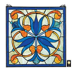 a blue and orange stained glass window with an ornate design on the bottom half of it