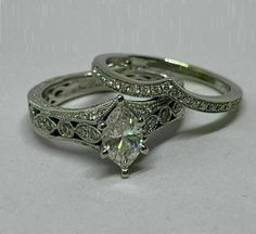 two wedding rings with diamond accents on each one and an engagement ring in the other