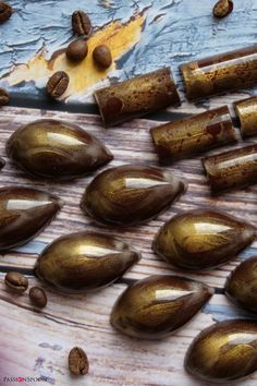 some coffee beans are on a wooden table