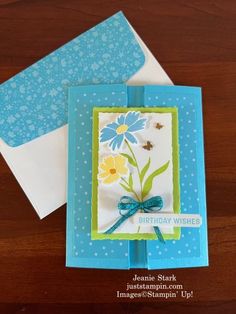 two cards with blue and yellow flowers on them, one has a card saying happy birthday wishes