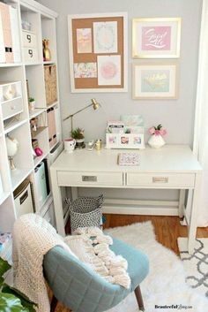 a white desk with lots of pictures on the wall and a chair in front of it