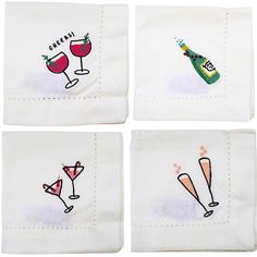 four embroidered napkins with wine glasses on them