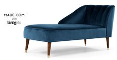 an upholstered blue chair with wooden legs