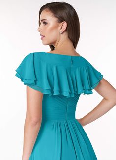 a woman is wearing a blue dress with ruffles on the shoulders and back