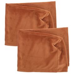 two brown napkins sitting on top of each other