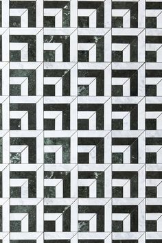 black and white marble tiles with geometric designs