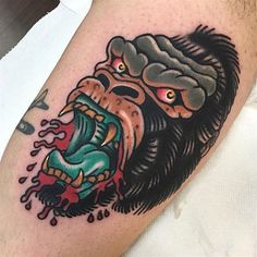 a man's arm with a tattoo on it and an image of a gorilla