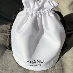 Brand New Drawstring Bag By Chanel. Black Detailing On A White Bag. Classic! Trendy White Bucket Bag As Gift, Trendy Pouch With Dust Bag As Gift, Chic White Bucket Bag As Gift, Chic White Bucket Bag For Gift, White Pouch Bucket Bag For Travel, White Bucket Bag For On-the-go, Chic Bucket Pouch As A Gift, Chic Bucket-shaped Gift Pouch, Chic Travel Bucket Drawstring Bag